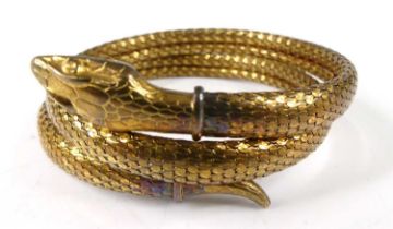 A gilt metal cuff bangle fashioned as a snake