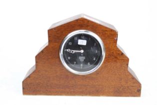 A Smiths for Bentley Motors dashboard clock in a made-up oak case, dial dia. 7cm