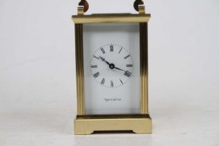 A Mappin & Webb lacquered brass carriage clock, late 20th century, having visible platform