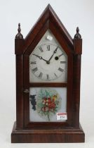 A late 19th century American Ansonia rosewood cased mantel clock of architectural outline having a