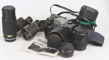 A Pentax K1000 film camera; together with various lenses and accessories to include a Makinon lens