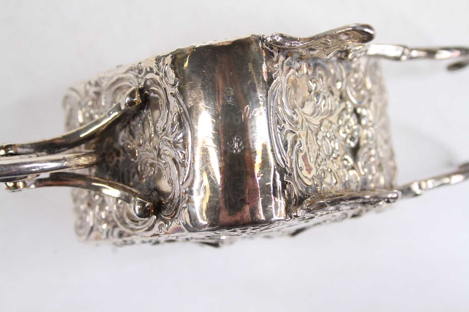 A late 19th century continental silver and embossed miniature wheelbarrow, decorated with winged - Image 3 of 11