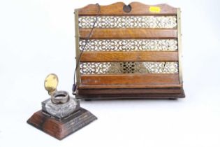 An early 20th century oak and pierced brass bookstand, height 26cm, together with a leather clad