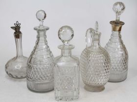 A collection of five 19th century and later cut glass decanters, largest height 33cm