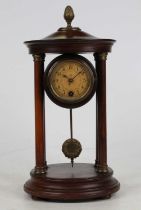 An early 20th century portico clock, being of stained walnut(?) and by Hamburg & American Clock