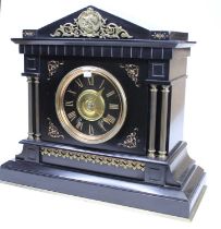 A late Victorian slate mantel clock, case of architectural outline, with brass mounts and by