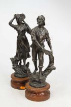 A pair of 19th century French spelter figures, each upon a turned wood plinth, height 37cm