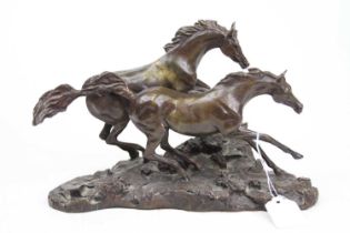 A bronze model of galloping horses, width 28cm