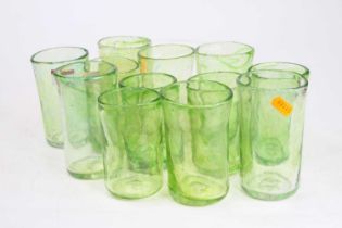 A set of 12 green glass tumblers, each signed Dillon, of varying size, largest height 13cm