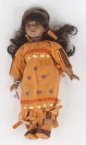 A Sasha porcelain doll, shown in native American style dress, height 40cm