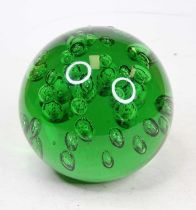 A large green glass paperweight, having bubble decoration, height 14cm