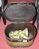 A set of seven Victorian brass graduated weights The largest is 7lb and approx. 18.5cm high.