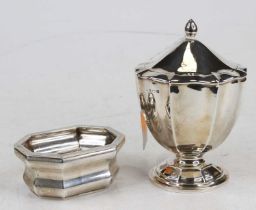 An Edwardian silver pedestal tea caddy, with hinged cover, h.12.5cm; together with a Chester