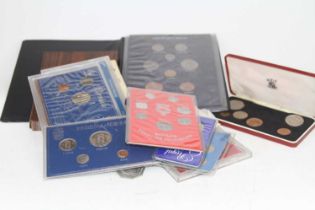 A collection of coins and year sets to include a 1976 Isle of Man proof set
