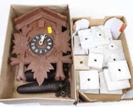 A Swiss cuckoo clock together with various marble clock mounts