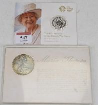 A 2016 commemorative £20 silver coin, the 90th Birthday of Her Majesty The Queen, issued by the