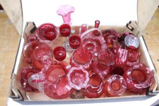A collection of Victorian and later cranberry glassware to include jugs, vases and drinking glasses