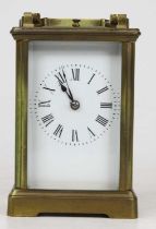 A 20th century lacquered brass cased carriage clock, having visible platform escapement, with