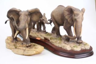 A Border Fine Arts model of an elephant, height 20cm, together with another elephant group, height