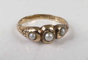 A circa 1900 9ct gold and seed pearl set ring, having carved shoulders, 1.5g, size O