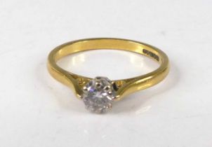 An 18ct gold diamond solitaire ring, the claw set round brilliant weighing approx 0.25 carats, 2,5g,