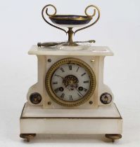 A late 19th century French alabaster mantel clock, the case surmounted with a pedestal bowl, and