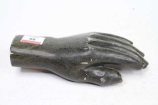 A green polished shona hardstone model of a hand,by Conrad Nyagwande, length 21cm