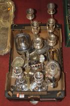 A box of assorted silver plated wares, to include pair of three-light candelabra, pair of single