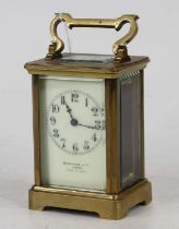 An early 20th century lacquered brass carriage clock, having a visible platform escapement, the