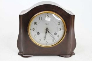 A Smiths Enfield bakelite cased mantel clock having a signed silver dial, twin winding holes for a