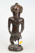 An African carved hardwood fertility figure, height 34cm
