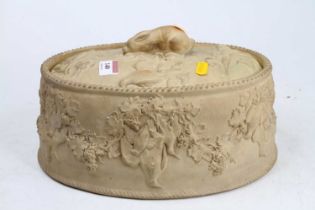 A 19th century Wedgwood cane ware game tureen, relief decorated with game and fruiting vine,