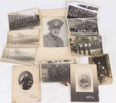 A collection of early 20th century military postcards, to include regimental photographic examples