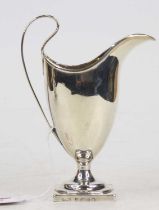 A circa 1830 silver helmet form cream jug, 4.3oz, h.13cm