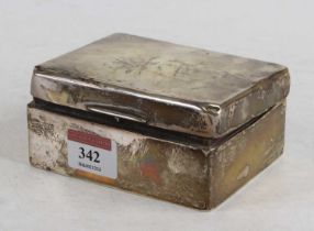 An engine turned silver table cigarette box, containing a small number of dress buttons and coins