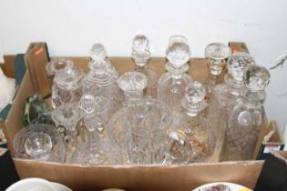 A collection of crystal glassware, primarily decanters
