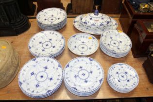 A Royal Copenhagen porcelain blue half lace pattern dinner service Mixed 1st and 2nd quality.