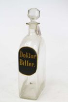 A glass medicine decanter and stopper, inscribed Doktor Bitter to the shoulder, height 34cm