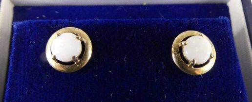 A pair of modern 9ct gold and cabochon opal set ear studs, dia.9mm