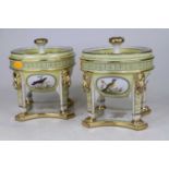 A pair of Sevres style porcelain pot pourri, each upon monopodia supports and decorated with