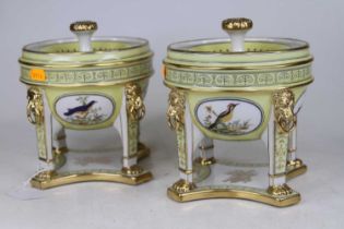 A pair of Sevres style porcelain pot pourri, each upon monopodia supports and decorated with