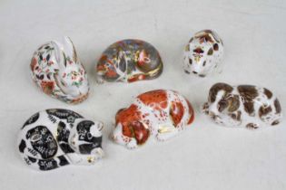 Six various Royal Crown Derby animal ornaments, to include sleeping cats, dogs and rabbits Catnip