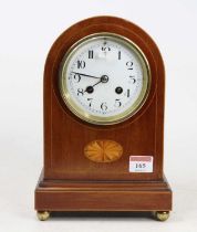 An Edwardian mahogany and inlaid dome top mantel clock having an unsigned white enamel Arabic