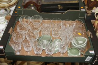 A collection of crystal drinking glasses, together with a collection of Wedgwood green jasper ware