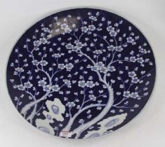 A Chinese blue and white porcelain charger, decorated with prunus, dia.46cm