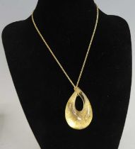 A drop shaped Murano glass pendant, with gold coloured detail, dimensions 48 x 30mm, attached to