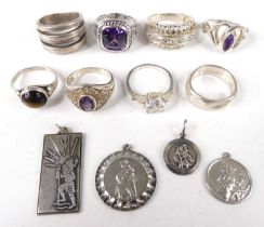 A collection of modern silver dress rings, to include amethyst and paste set examples; together with