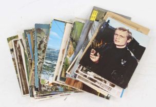 A collection of mainly 20th century postcards to include topographical views and portrait examples