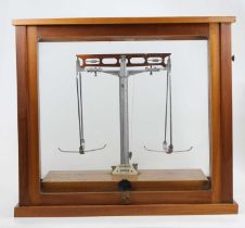 A Gallenhamp scientific beam scale, in glazed hardwood case, w.45cm