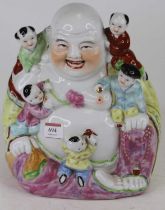 A Chinese porcelain figure of Buddha amongst children, h.27cm